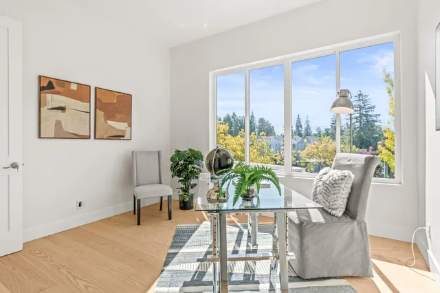 a view of a dining room with furniture window and outside view