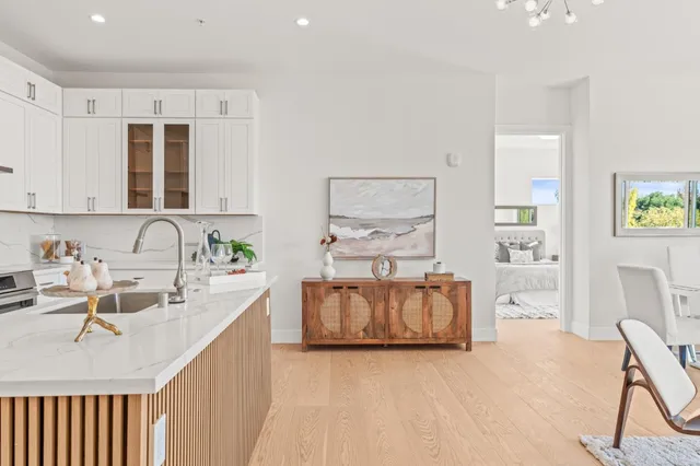 a kitchen with a sink cabinets and window