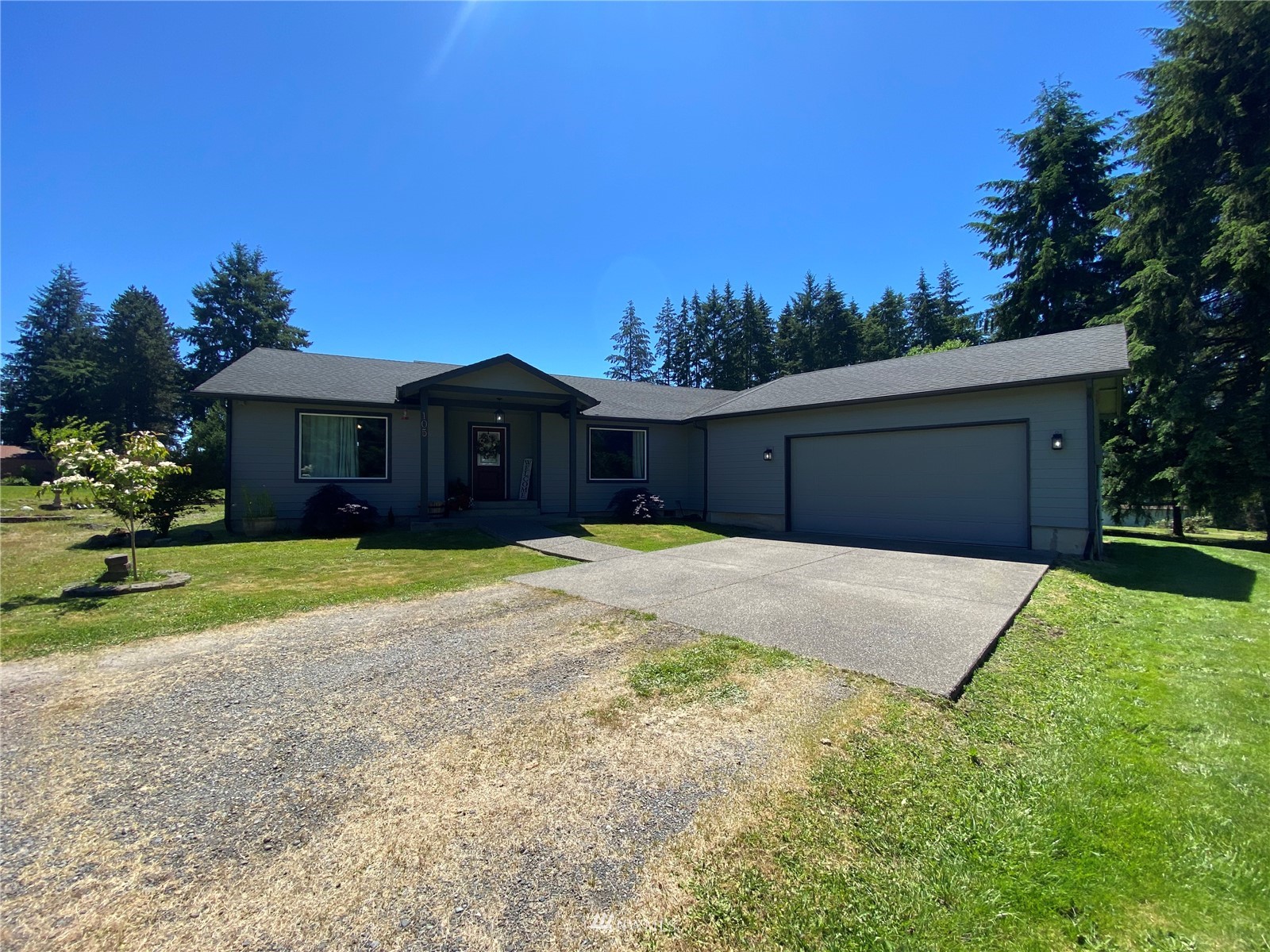 105 Cristler Road Chehalis, WA 98532 - Photo 1 of 37 a front view of a house with a yard and garage