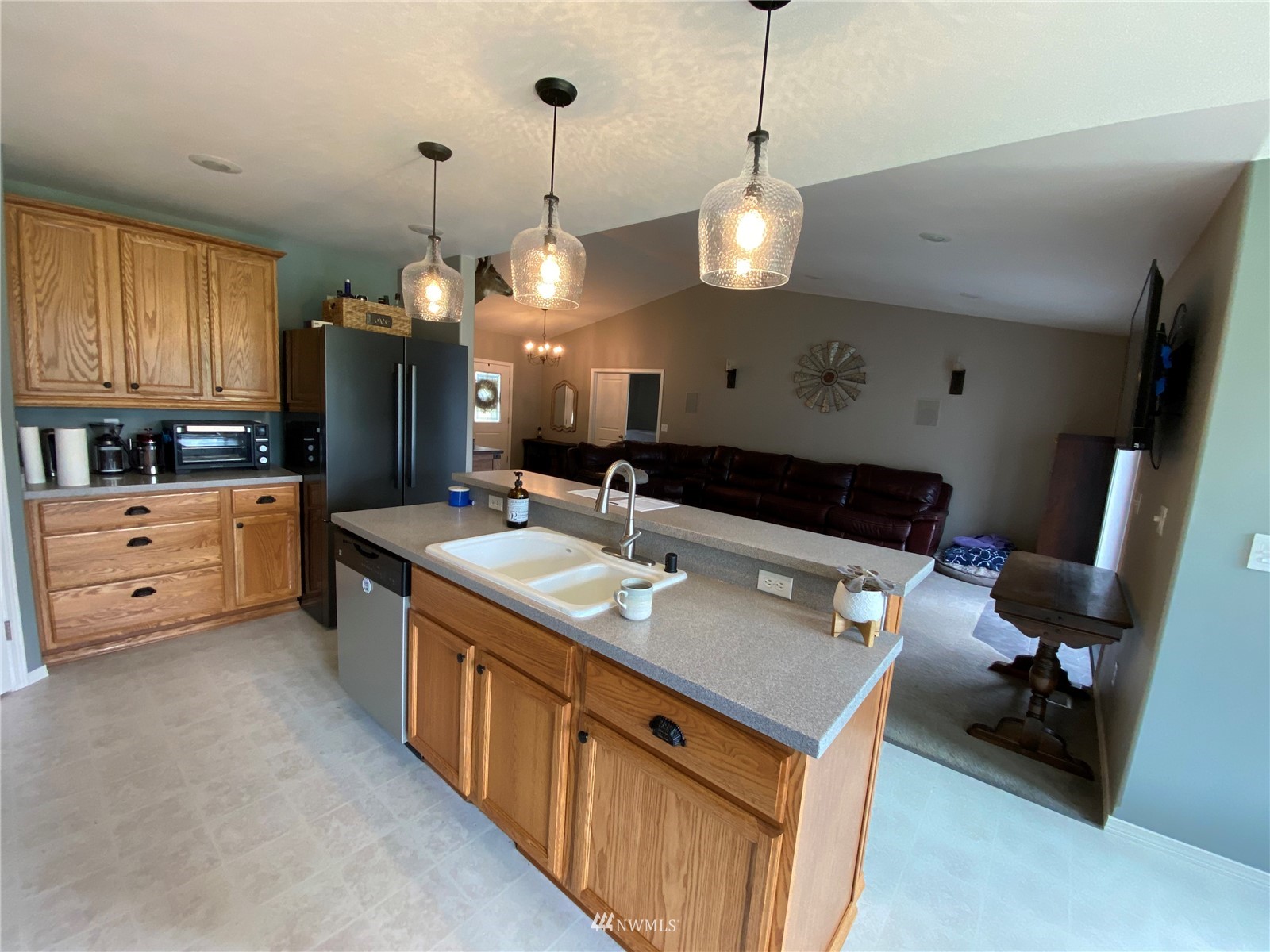 105 Cristler Road Chehalis, WA 98532 - Photo 17 of 37 a kitchen that has a lot of cabinets in it and wooden floors