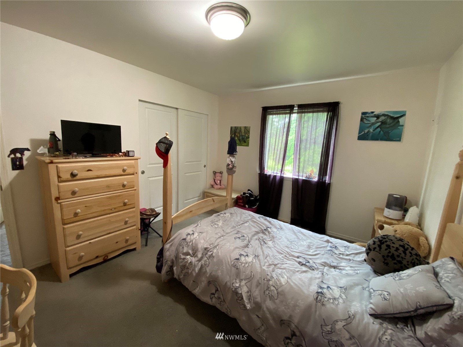 105 Cristler Road Chehalis, WA 98532 - Photo 28 of 37 a bedroom with a bed and flat screen tv