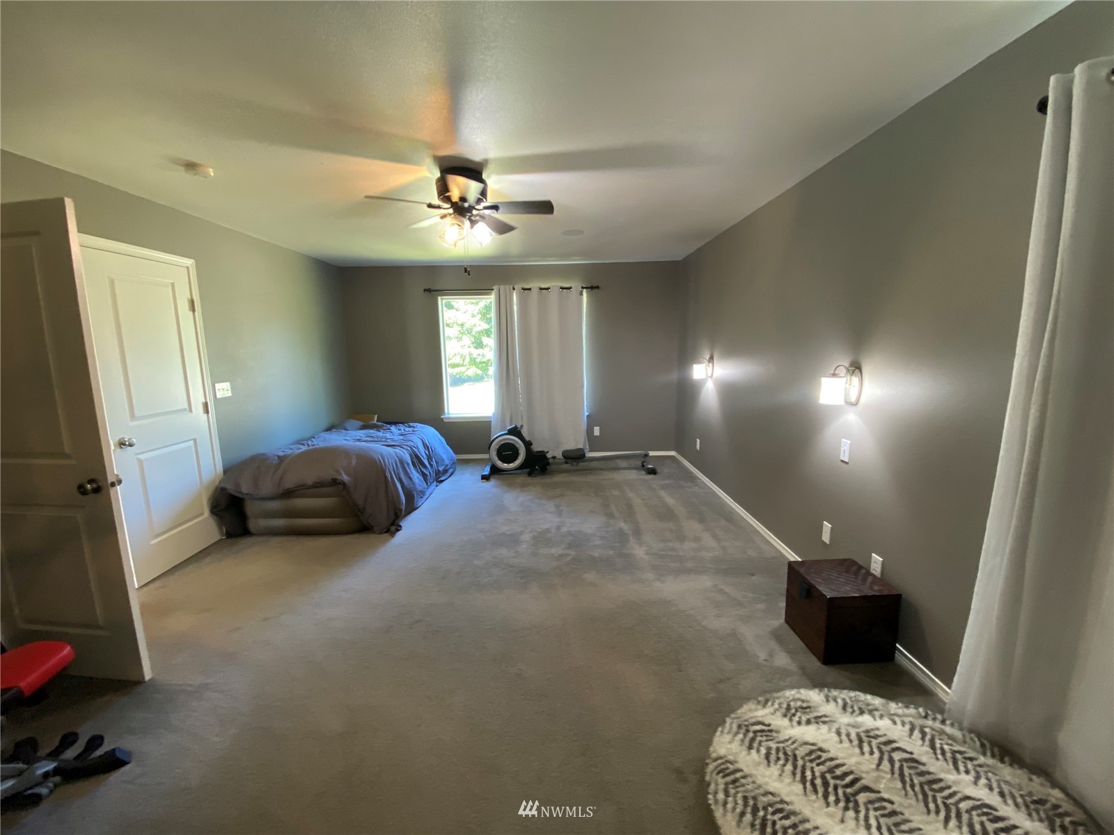 105 Cristler Road Chehalis, WA 98532 - Photo 34 of 37 a large bedroom with a bed and a chandelier