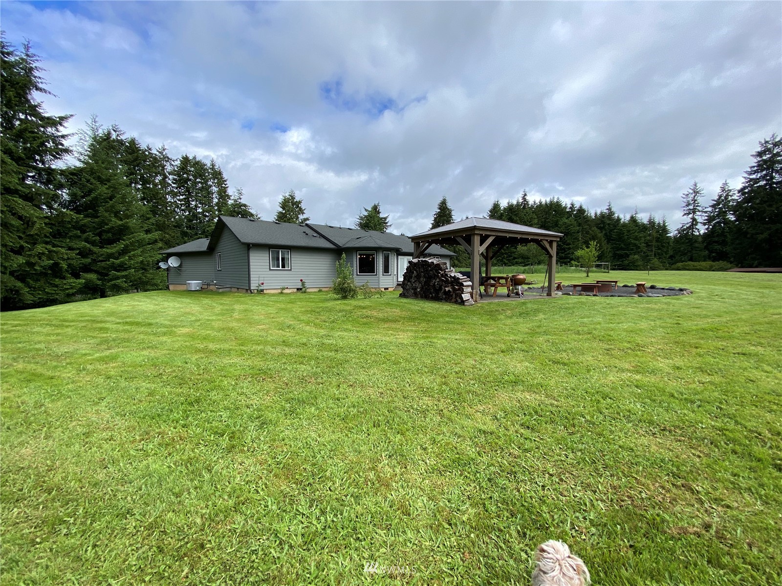 105 Cristler Road Chehalis, WA 98532 - Photo 5 of 37 a view of a house with a yard and sitting area