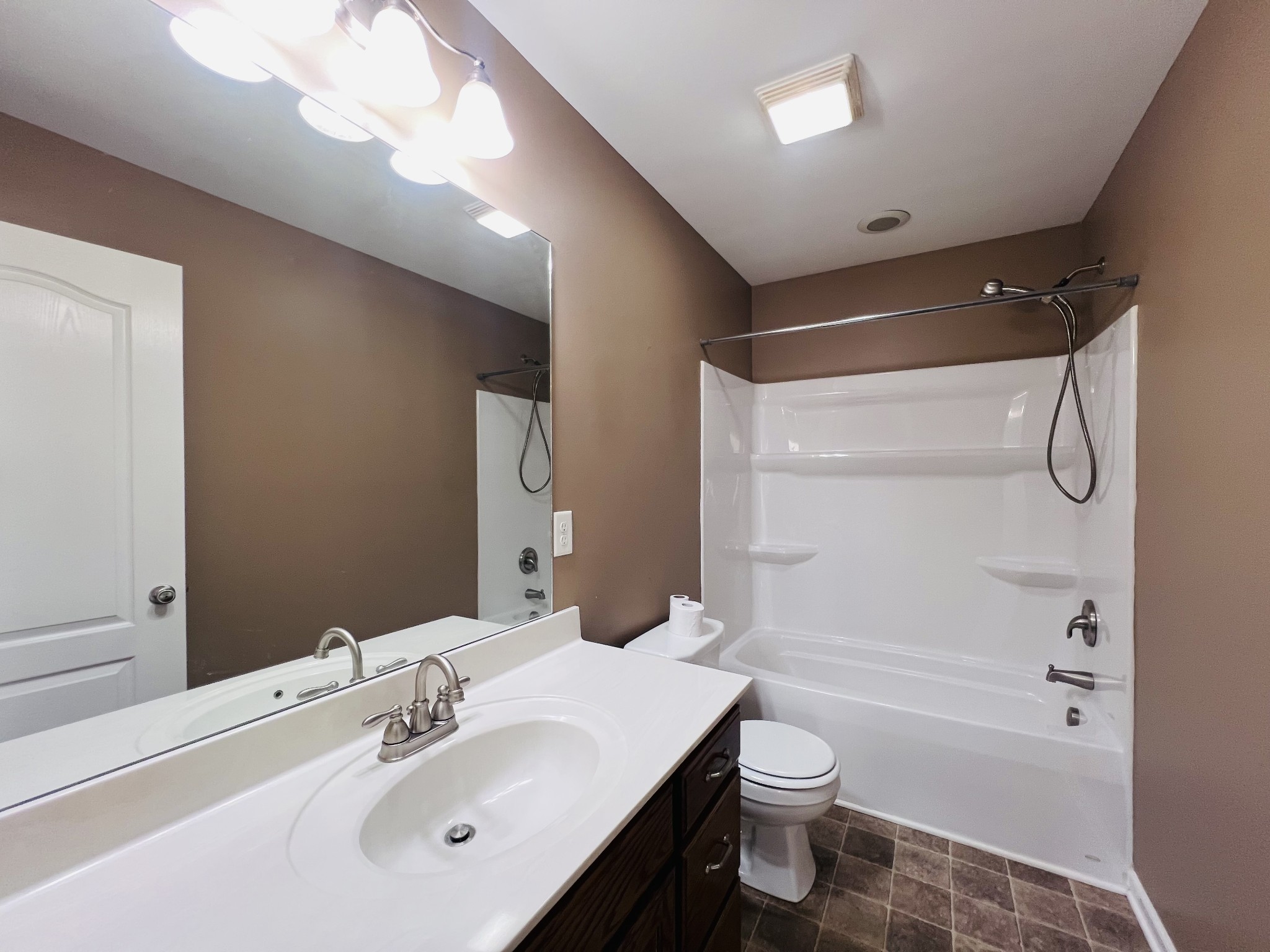 8659 Dog Branch Road Mount Pleasant, TN 38474 - Photo 33 of 44 a bathroom with a sink a toilet and shower