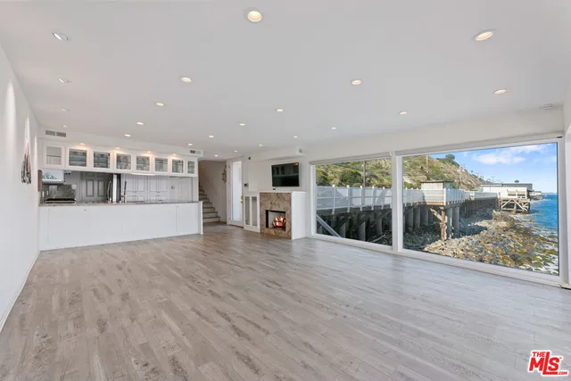 a view of roof deck with seating space and living room view