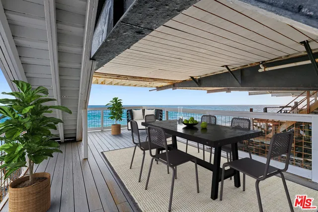 a patio with table and chairs