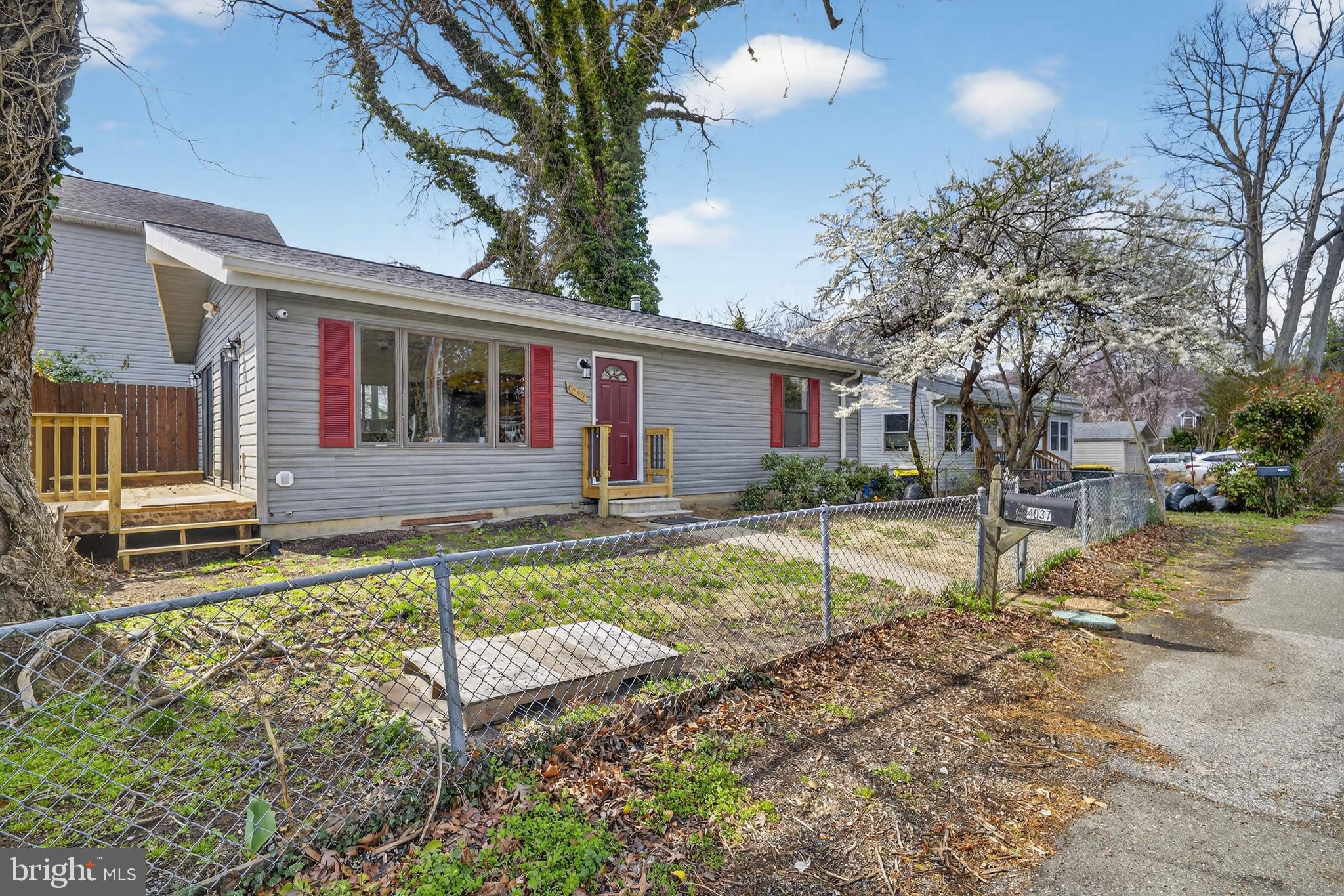 4037 1st Street Chesapeake Beach, MD 20732 - Photo 23 of 26 front view of a house with a yard