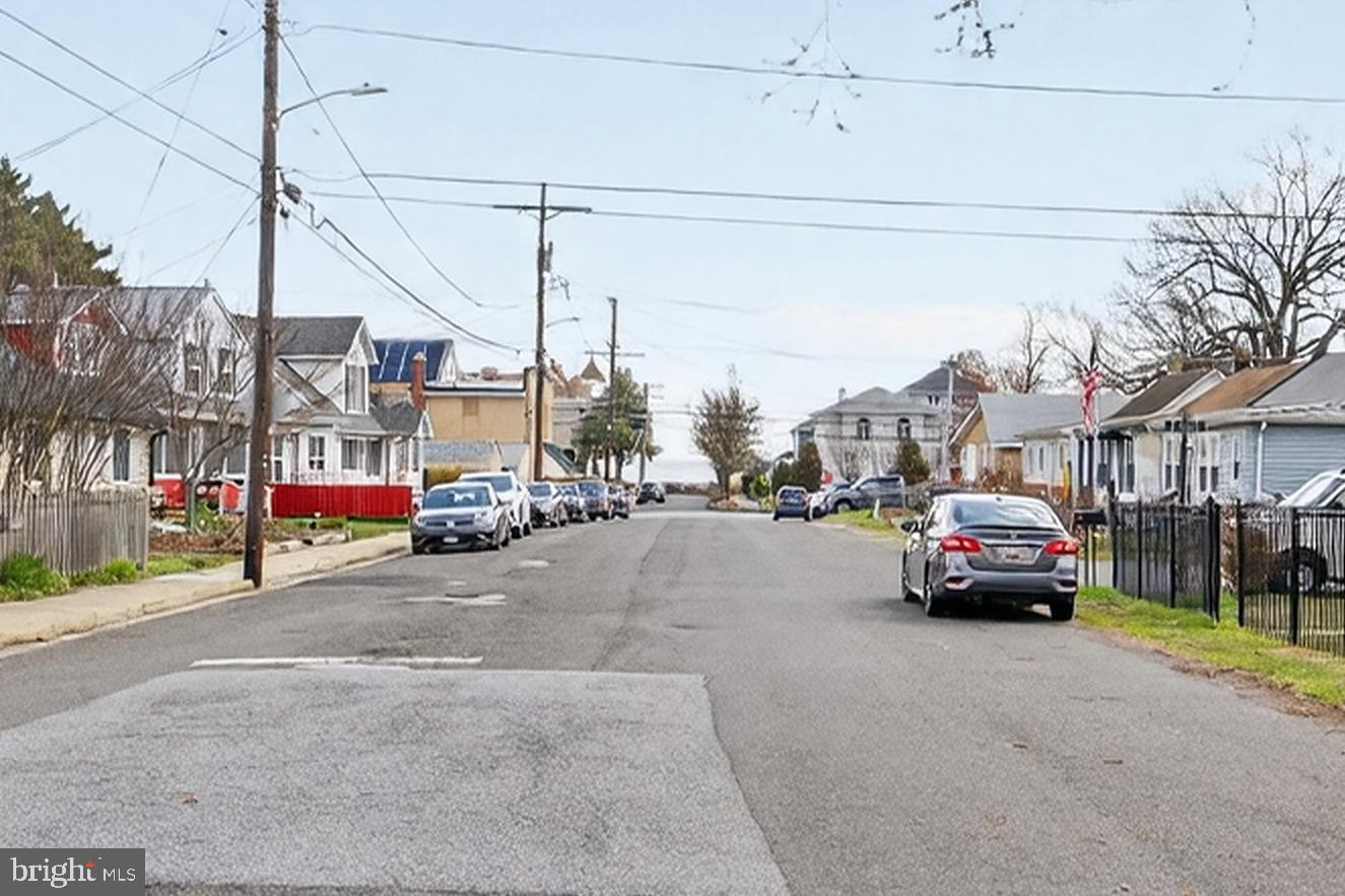 4037 1st Street Chesapeake Beach, MD 20732 - Photo 26 of 26 a car parked on the side of a street