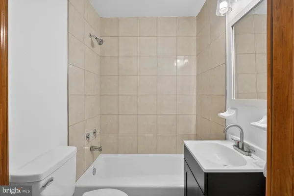a bathroom with a sink a mirror and vanity