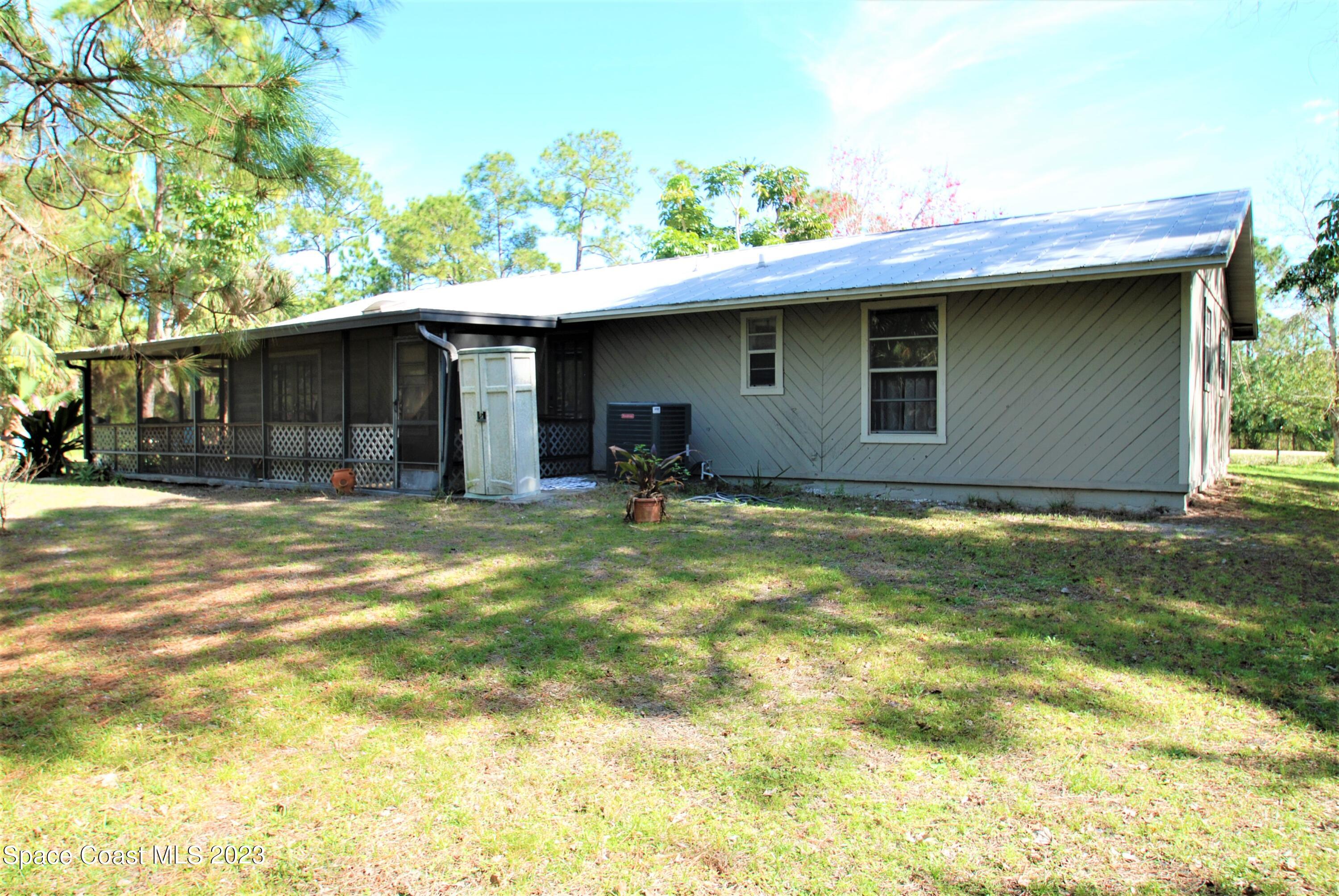 2450 Ski Lane Malabar, FL 32950 - Photo 22 of 23 Back with Screen Patio