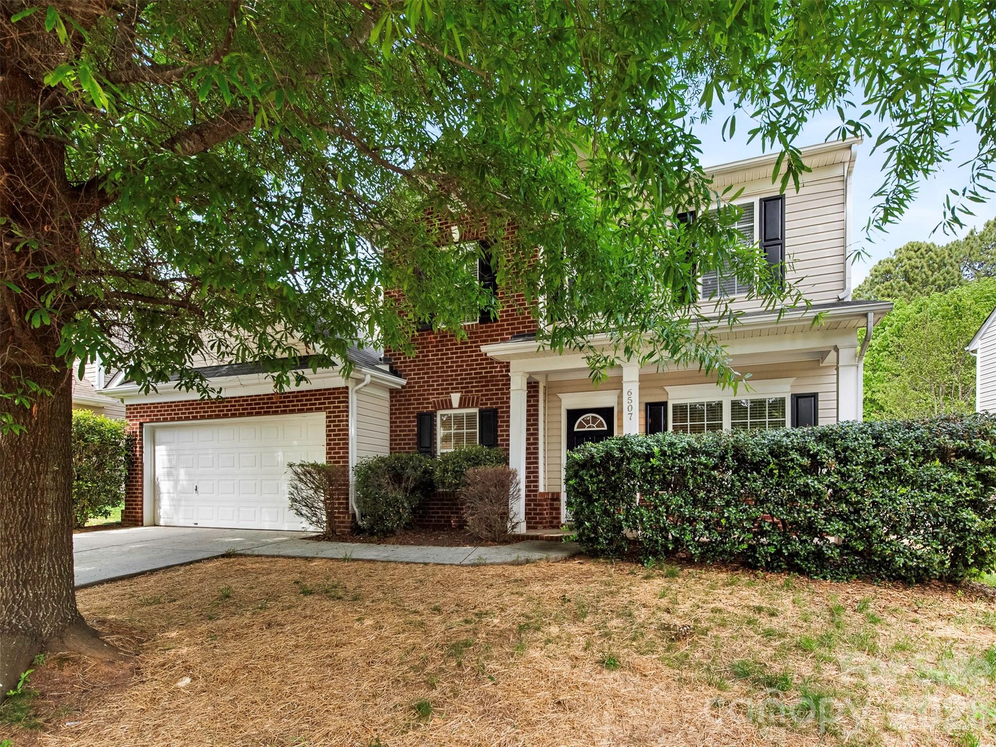 front view of a house with a yard