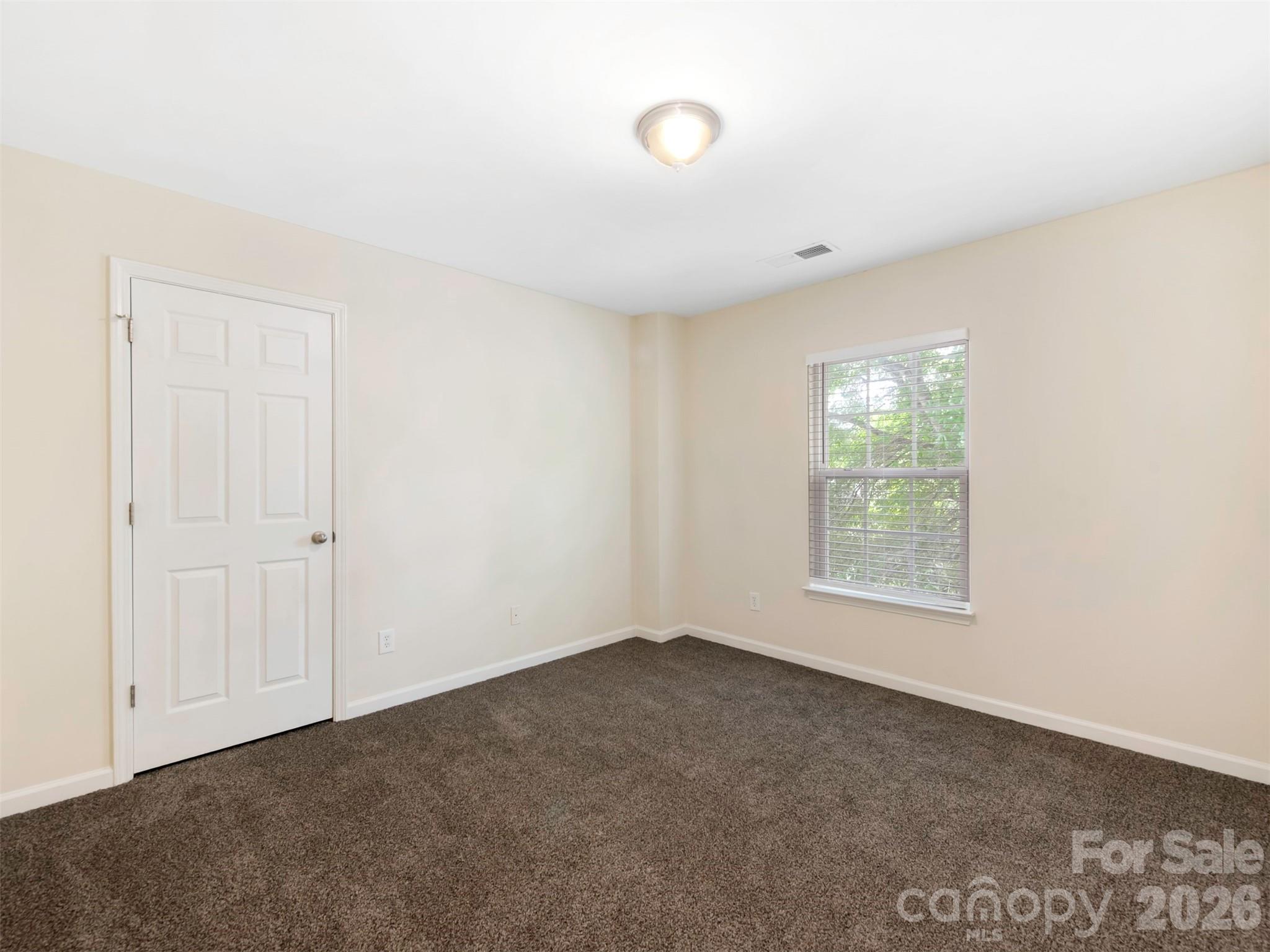 6507 Hermsley Road Charlotte, NC 28278 - Photo 14 of 40 an empty room with windows