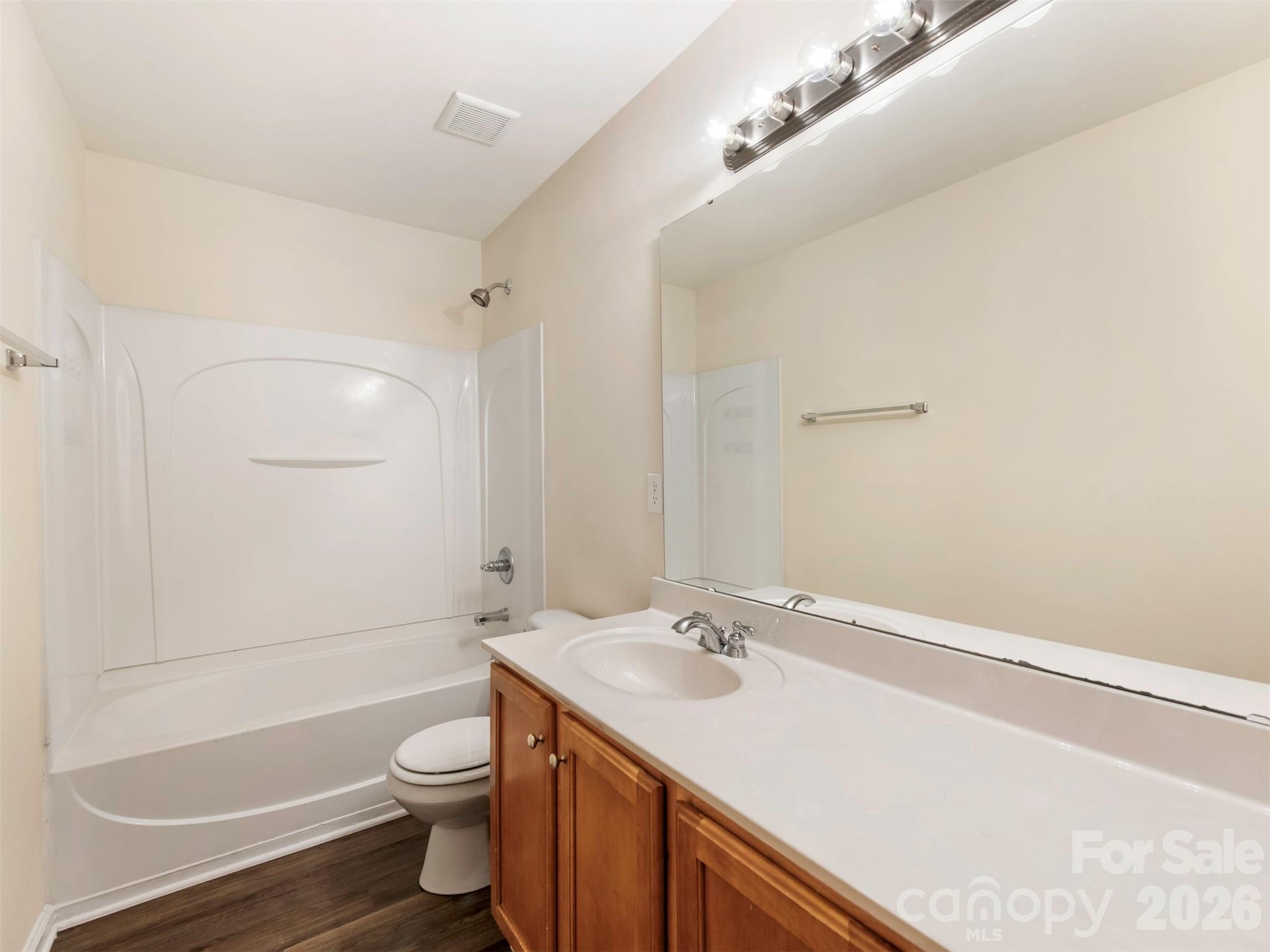 6507 Hermsley Road Charlotte, NC 28278 - Photo 15 of 40 a bathroom with a sink a toilet and shower
