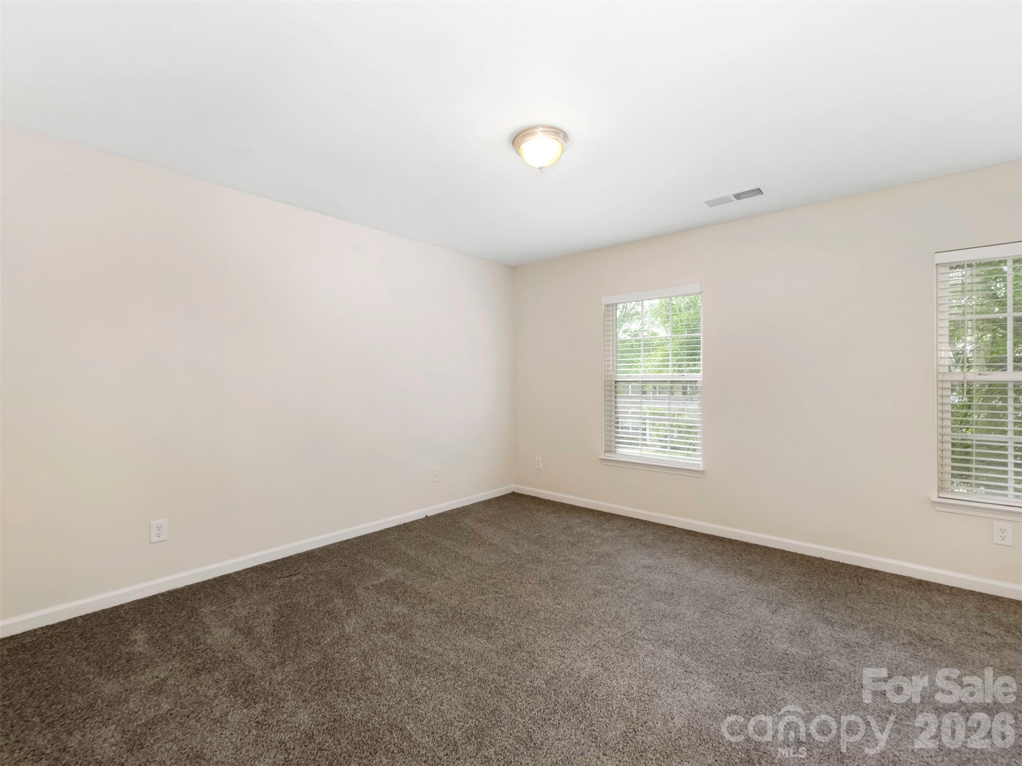 6507 Hermsley Road Charlotte, NC 28278 - Photo 16 of 40 an empty room with windows