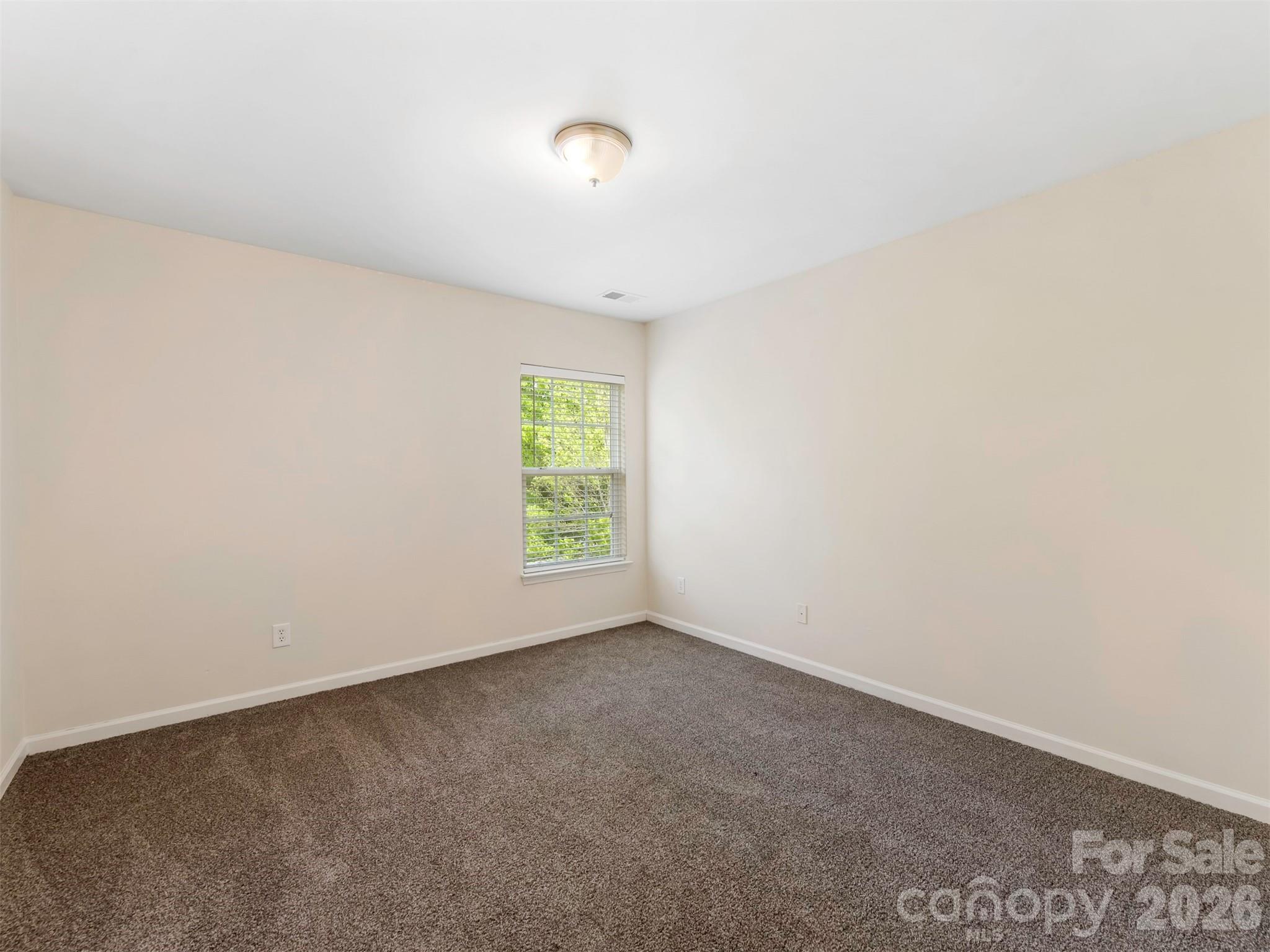 6507 Hermsley Road Charlotte, NC 28278 - Photo 18 of 40 a view of an empty room with a window