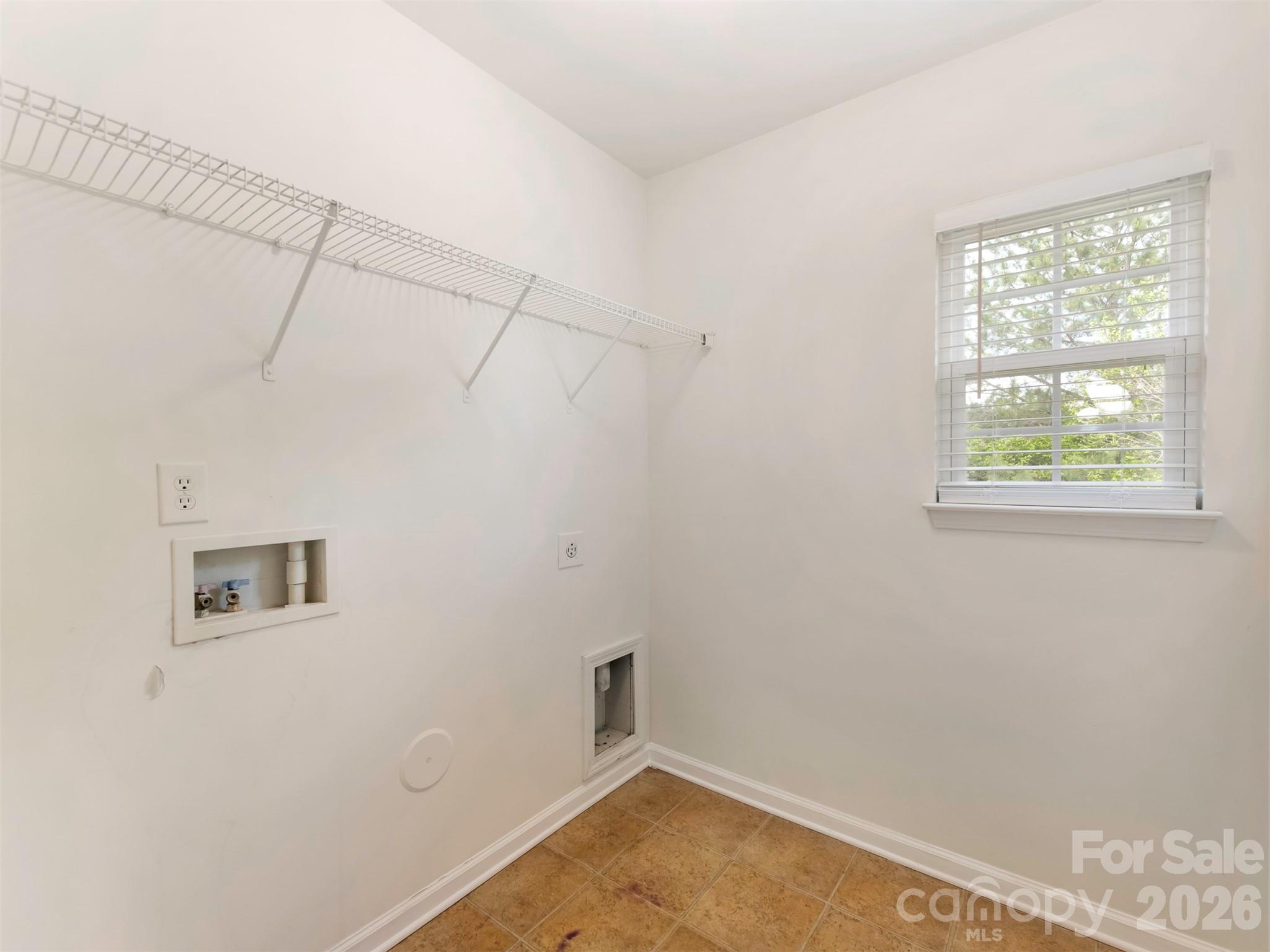 6507 Hermsley Road Charlotte, NC 28278 - Photo 20 of 40 a room with a window and a ceiling fan