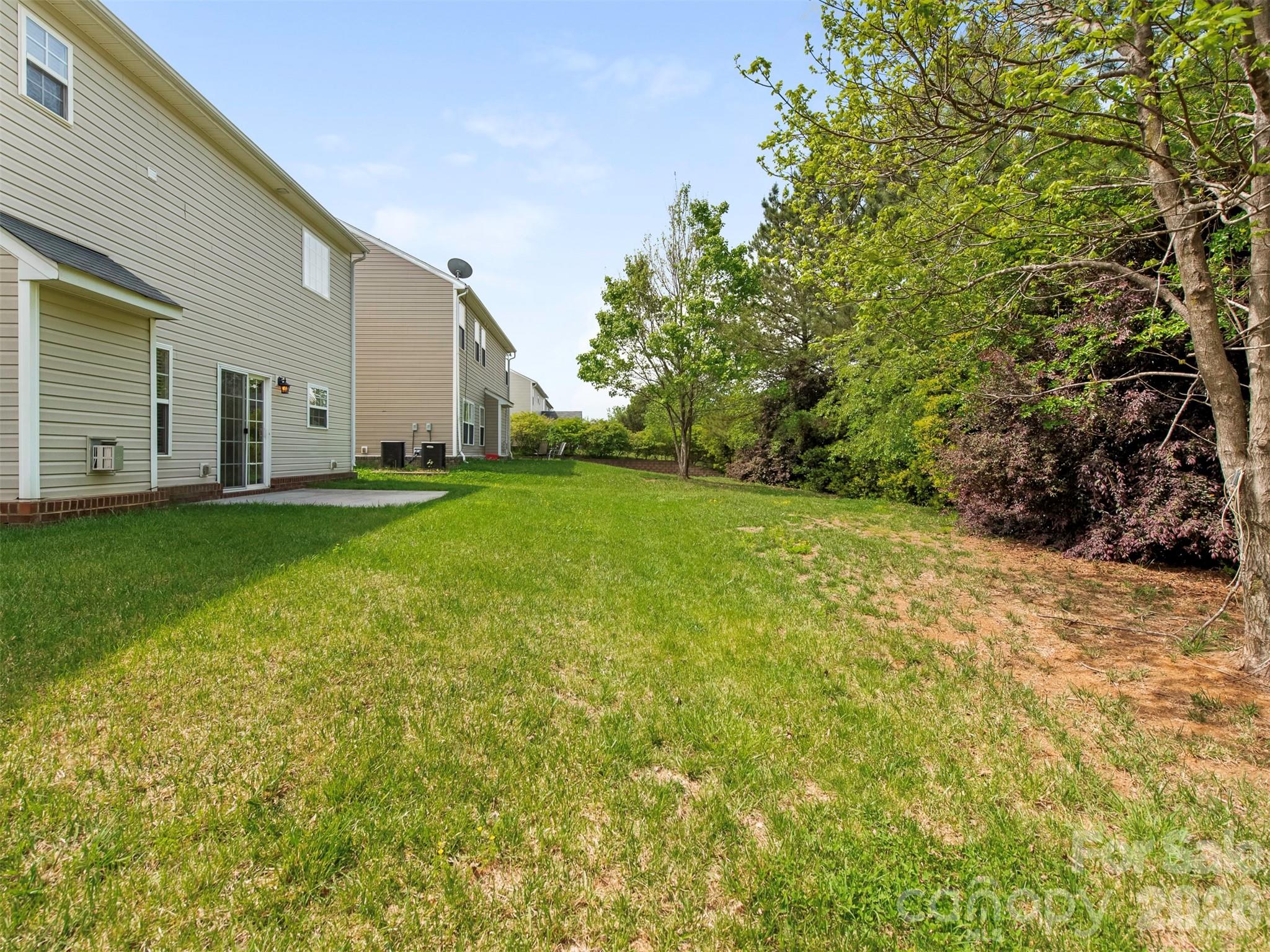 6507 Hermsley Road Charlotte, NC 28278 - Photo 25 of 40 a backyard of a house with lots of green space