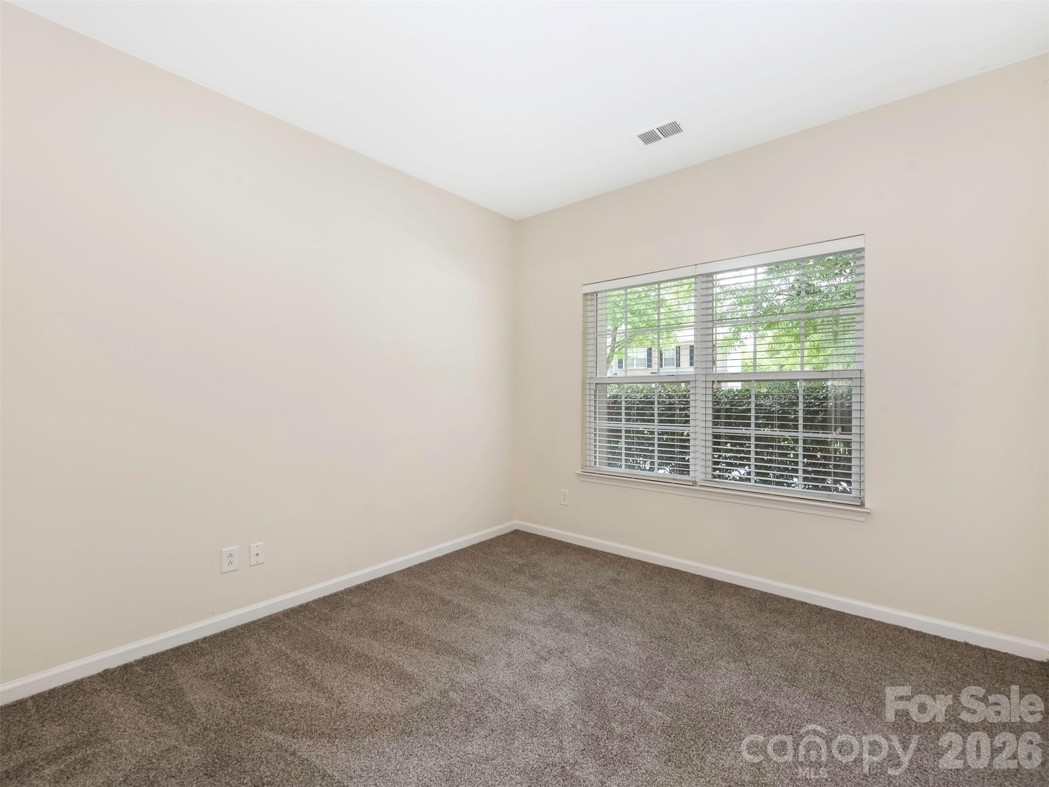 6507 Hermsley Road Charlotte, NC 28278 - Photo 29 of 40 an empty room with a window