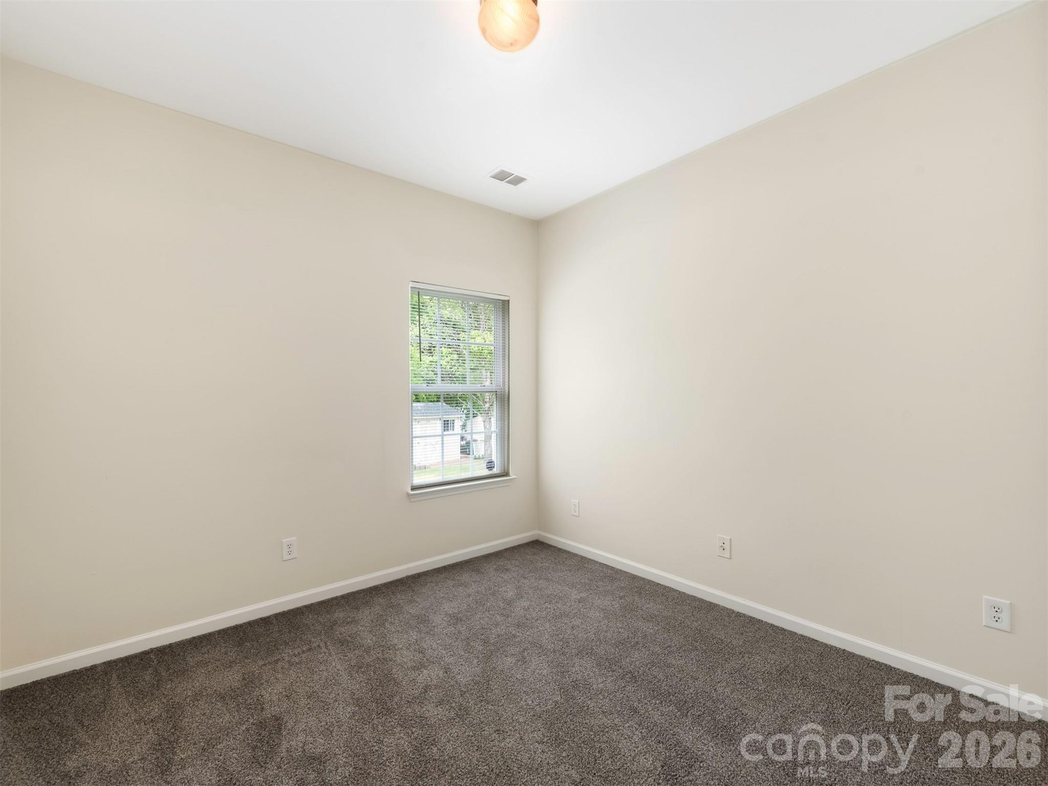 6507 Hermsley Road Charlotte, NC 28278 - Photo 31 of 40 an empty room with windows and closet