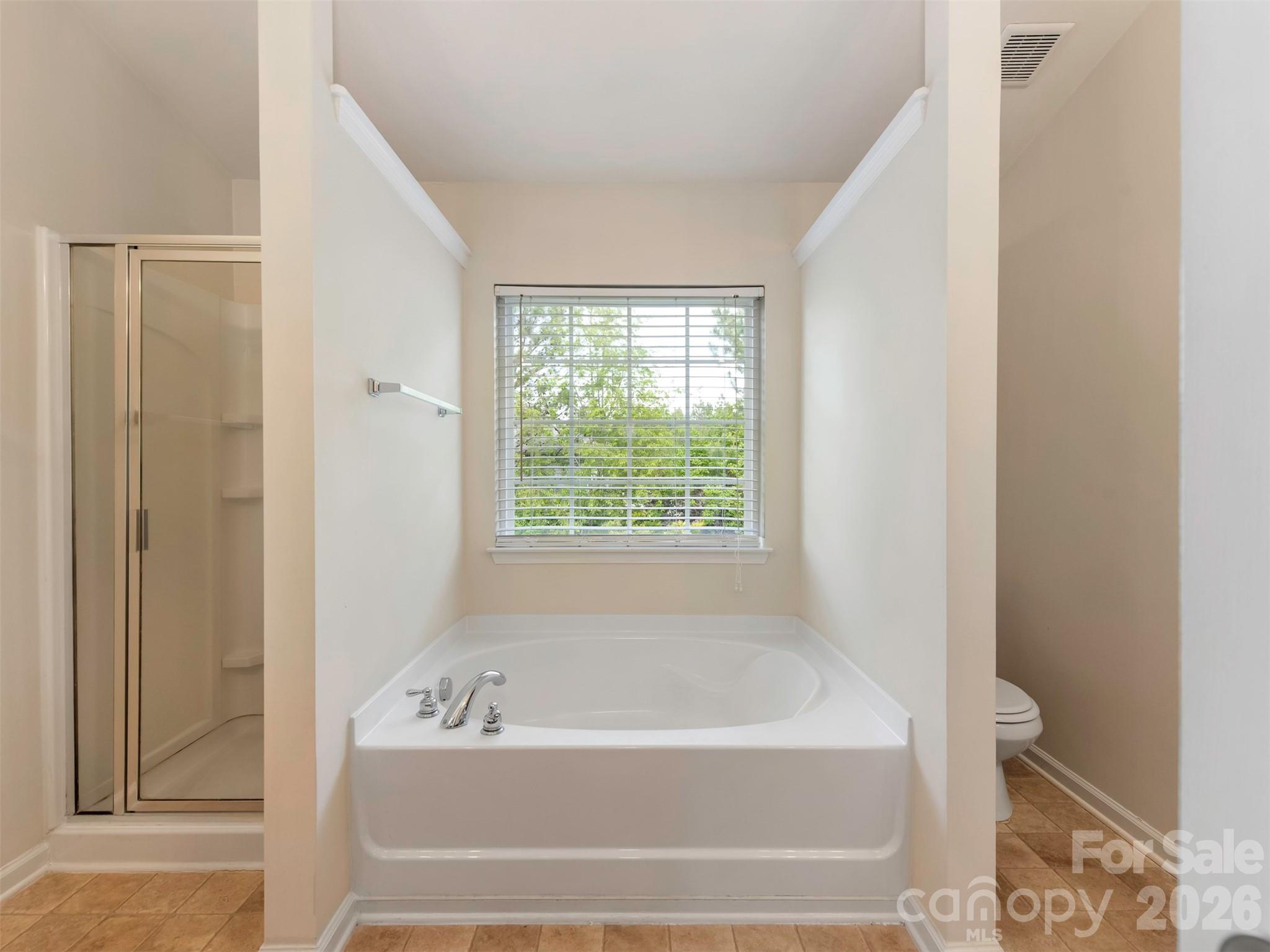 6507 Hermsley Road Charlotte, NC 28278 - Photo 39 of 40 a bathroom with a bathtub and shower