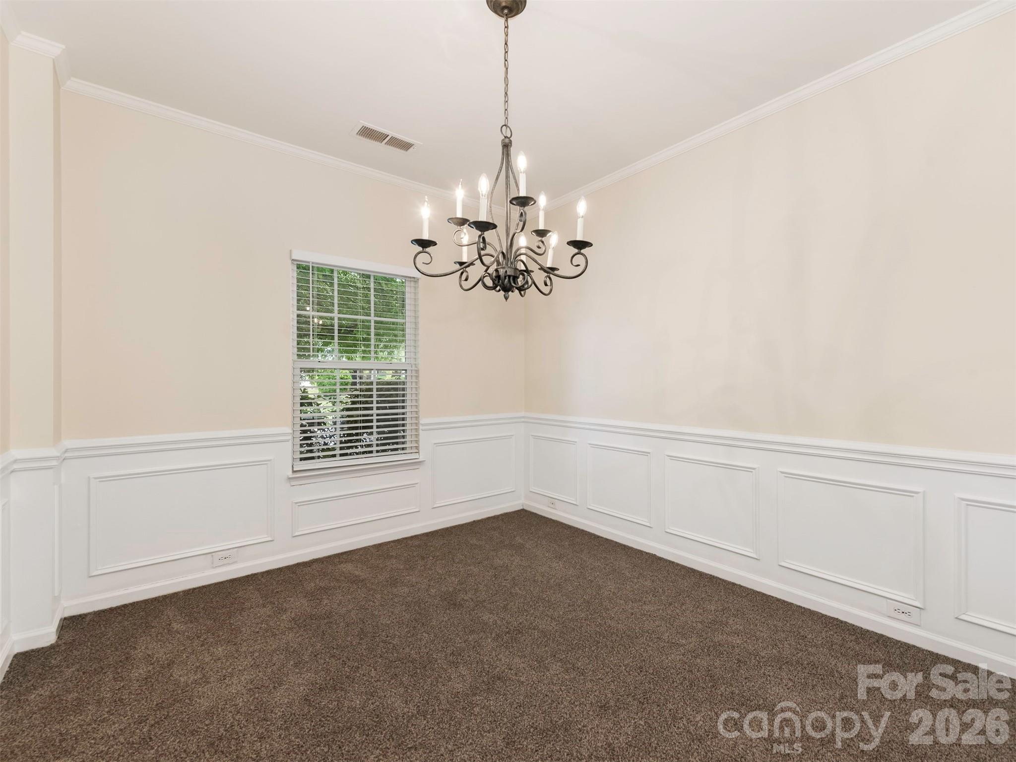 6507 Hermsley Road Charlotte, NC 28278 - Photo 4 of 40 a view of a room with window and chandelier fan