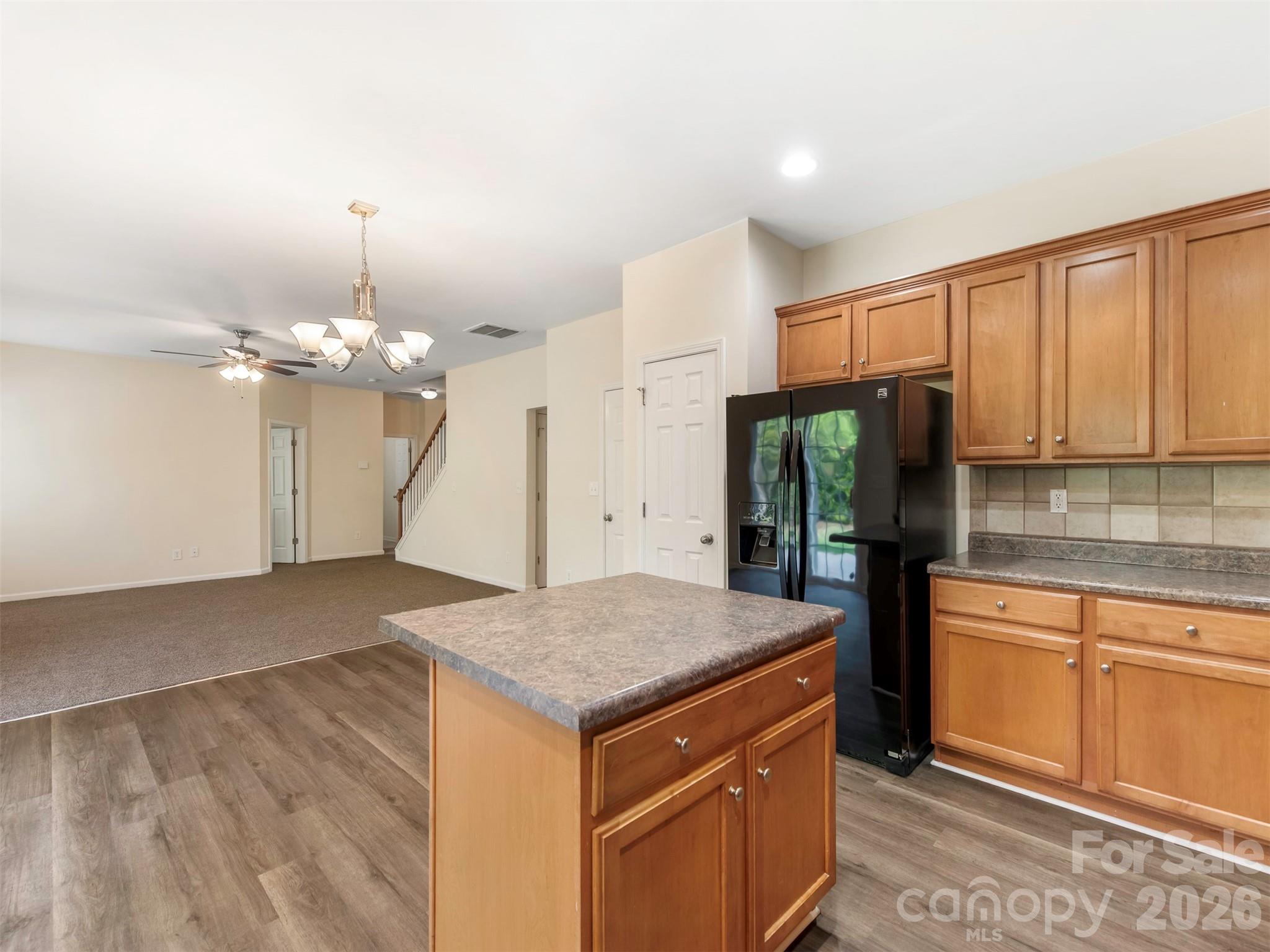 6507 Hermsley Road Charlotte, NC 28278 - Photo 9 of 40 a kitchen that has a lot of cabinets in it and stainless steel appliances