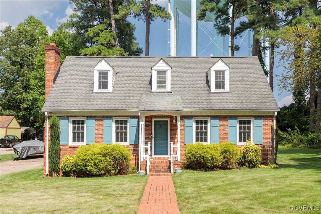 11601 Old Centralia Road Chester, VA 23831 - Photo 1 of 1 a front view of a house with garden