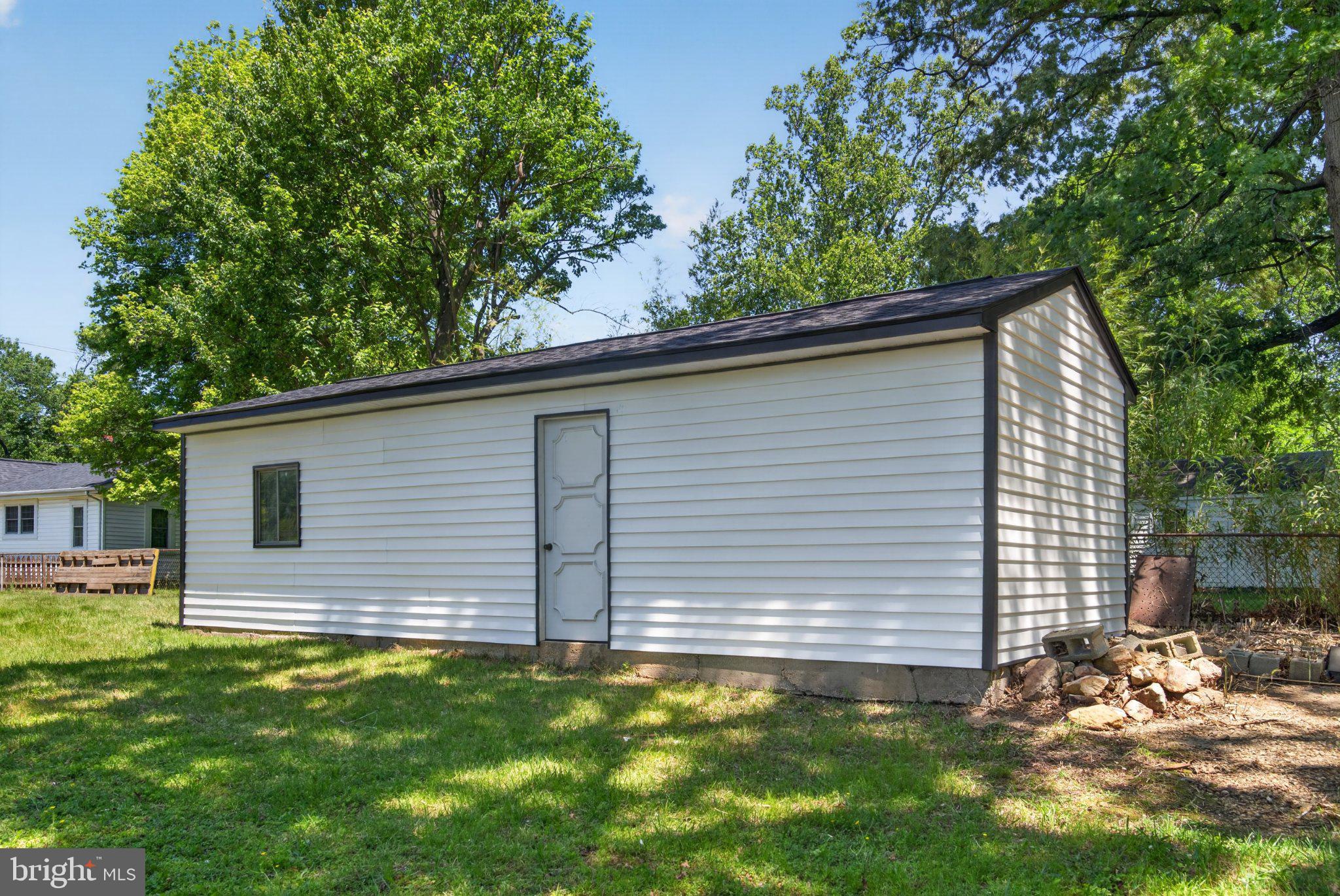 9081 Dumhart Road Laurel, MD 20723 - Photo 44 of 45 Charming shed nestled in green space.