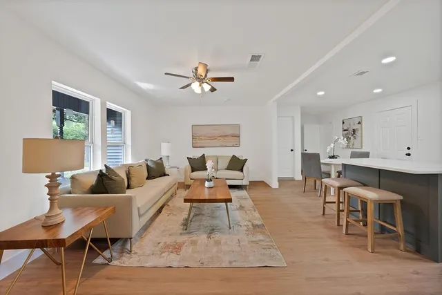 a kitchen with a sink a stove and cabinets