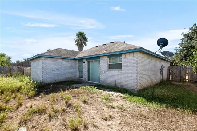 a view of a backyard with a small cabin