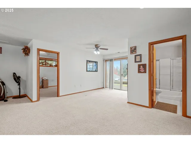 a view of an empty room with a fireplace