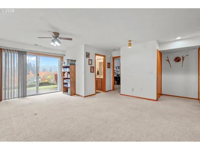 a view of a livingroom with entryway and stairs