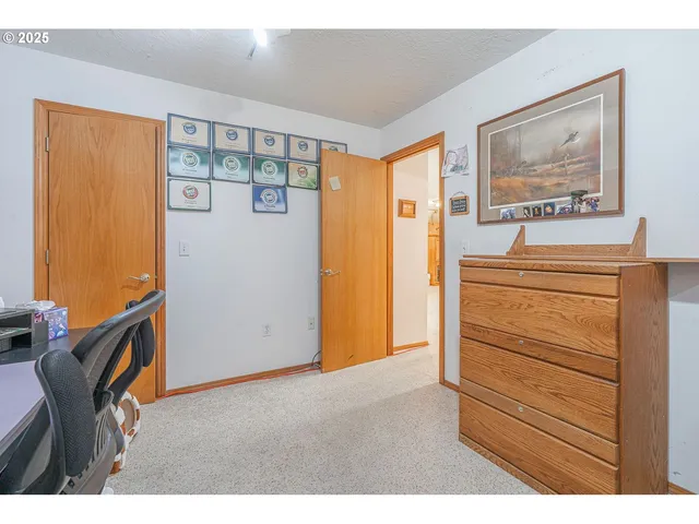 a bedroom with a bed and a mirror