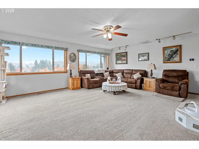 a living room with furniture and windows
