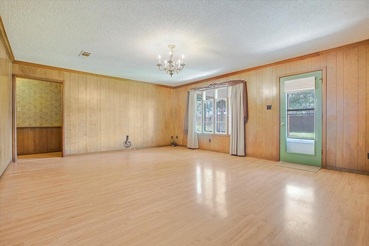 205 Smith Avenue New Home, TX 79381 - Photo 12 of 27 an empty room with windows and closet