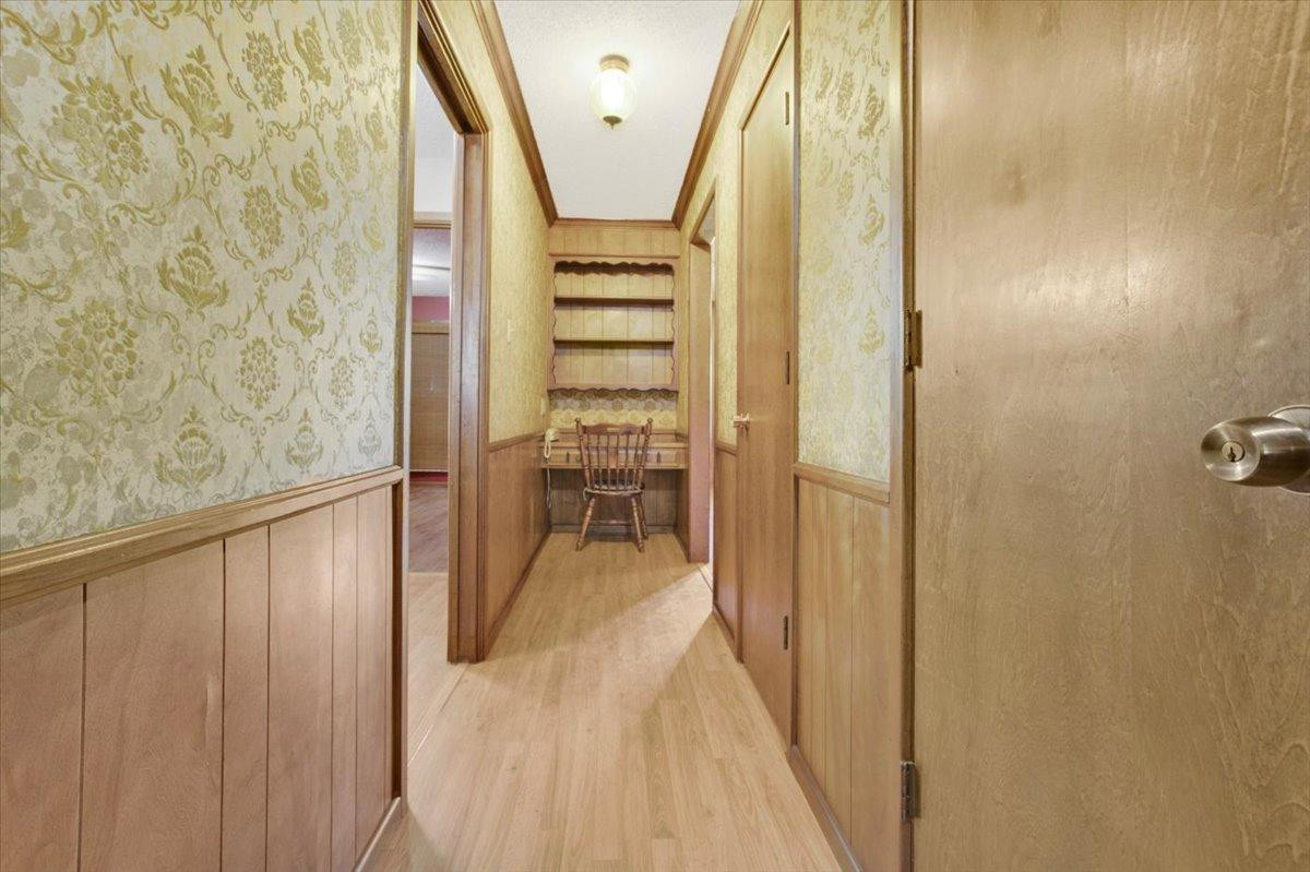 205 Smith Avenue New Home, TX 79381 - Photo 4 of 27 a view of entryway with wooden floor