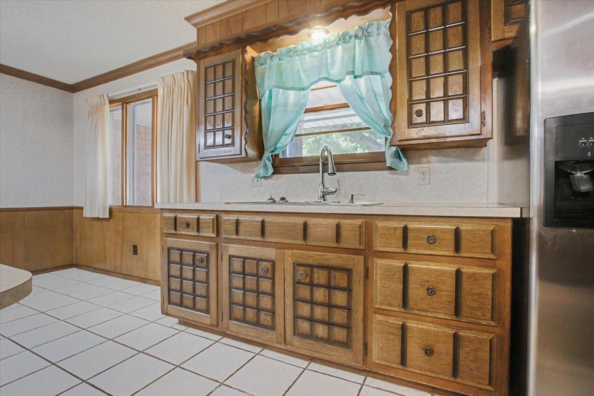 205 Smith Avenue New Home, TX 79381 - Photo 7 of 27 a bathroom with double vanity sink and mirror