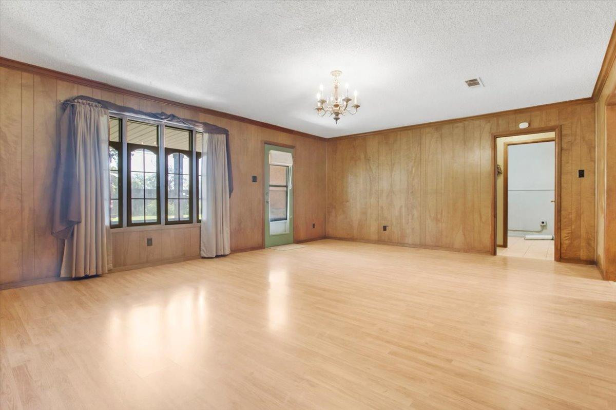 205 Smith Avenue New Home, TX 79381 - Photo 9 of 27 an empty room with windows and closet