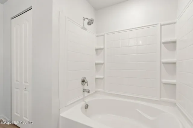 a bathroom with a sink toilet and a bathtub