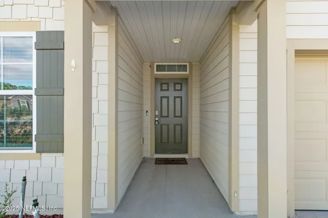a view of a hallway with windows
