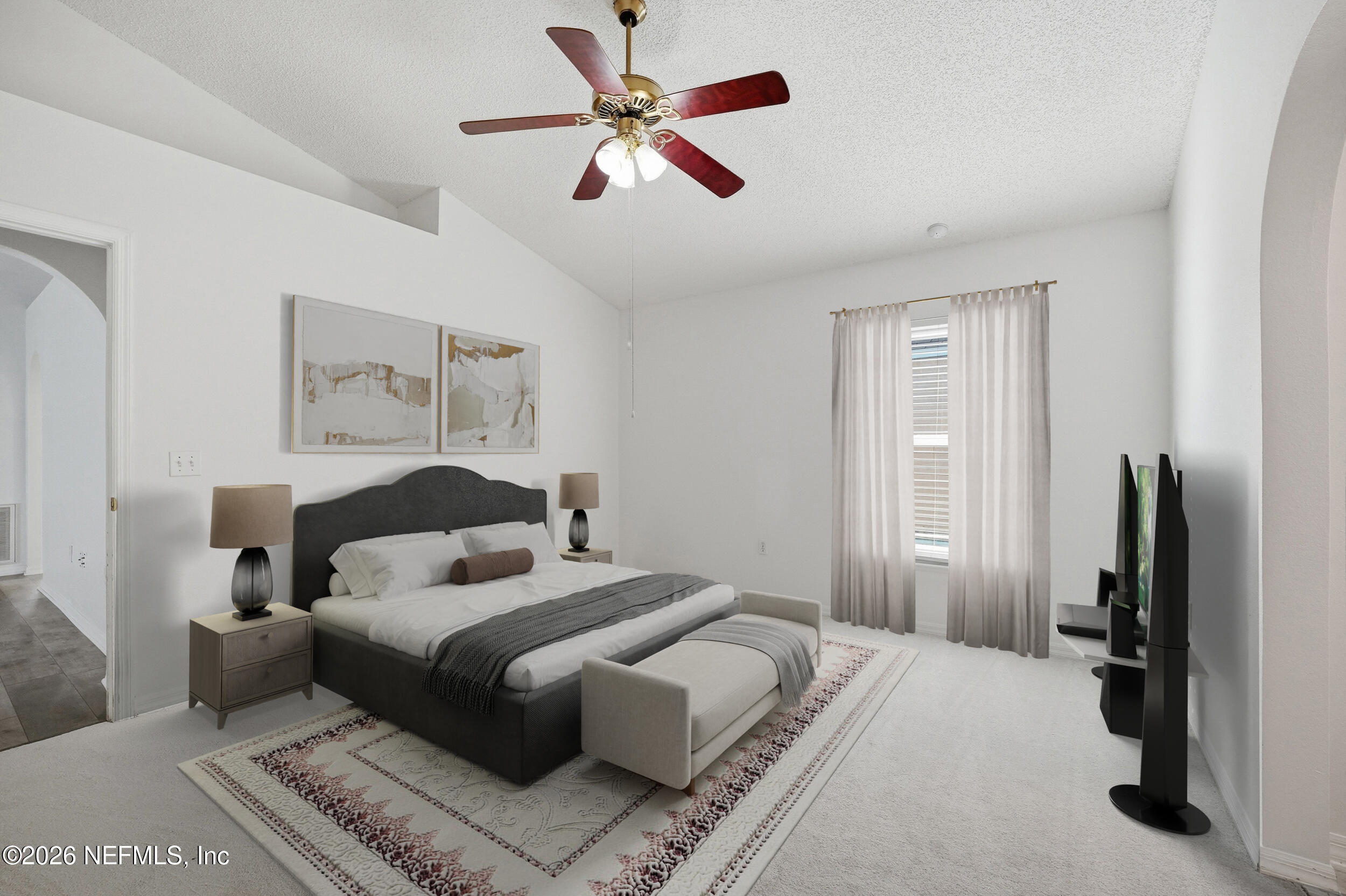 3380 Net Court Jacksonville, FL 32277 - Photo 11 of 20 a bedroom with a large bed and a flat screen tv