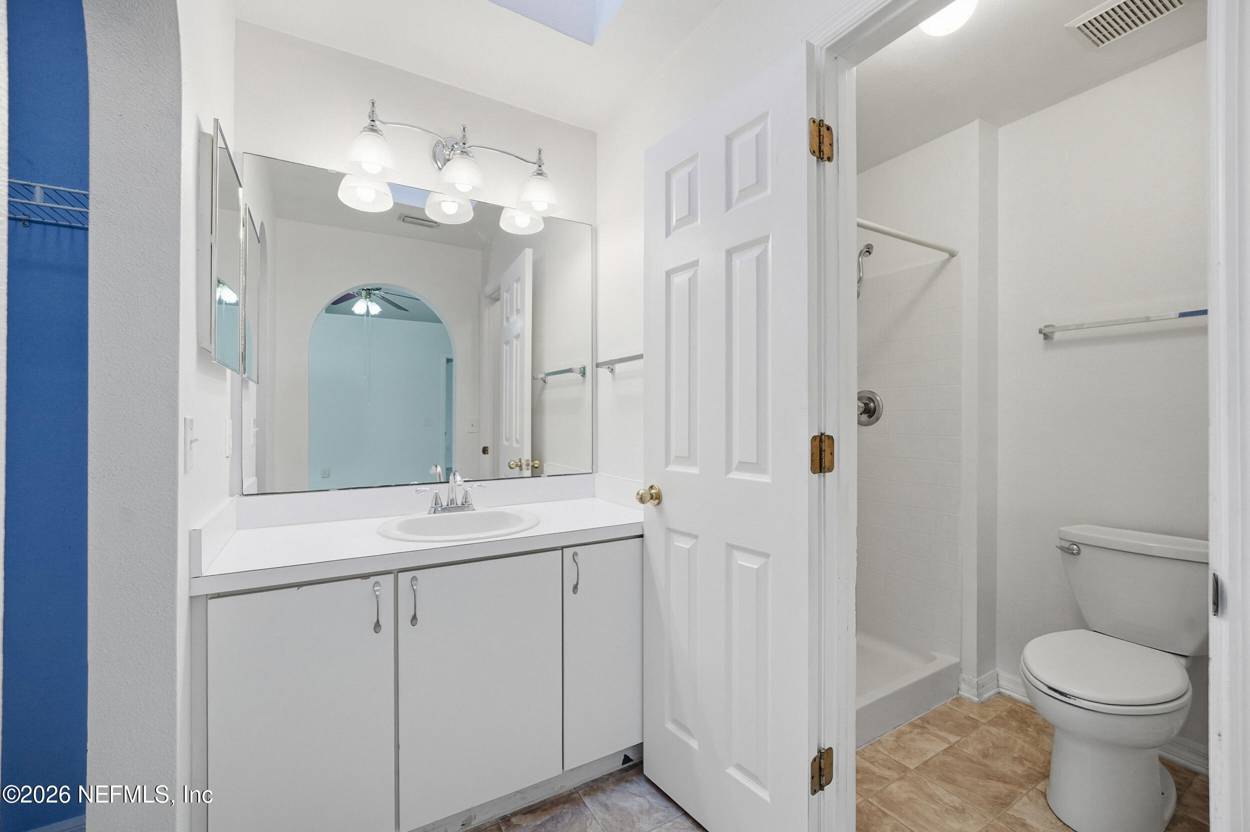 3380 Net Court Jacksonville, FL 32277 - Photo 13 of 20 a bathroom with a toilet sink and mirror