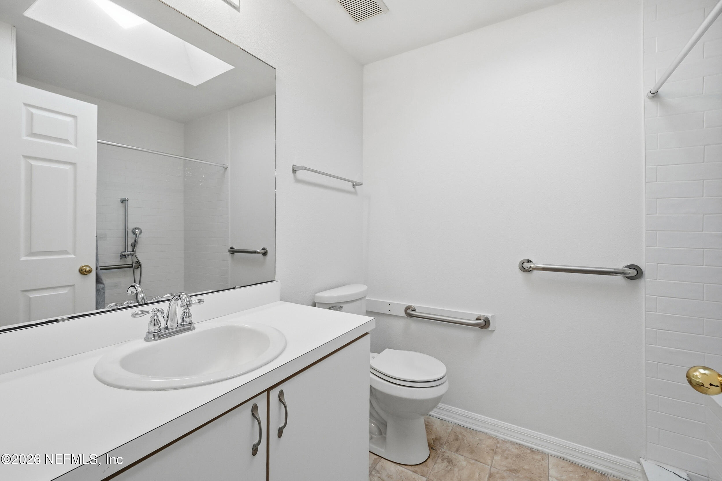 3380 Net Court Jacksonville, FL 32277 - Photo 16 of 20 a bathroom with a sink toilet and a mirror