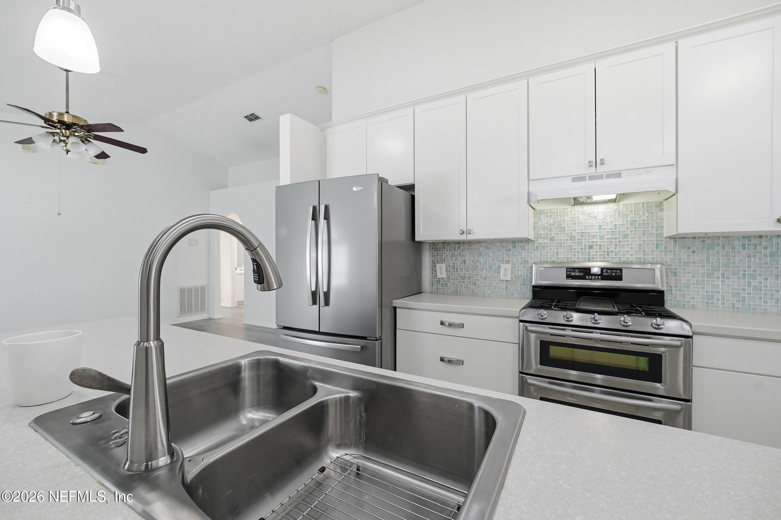 3380 Net Court Jacksonville, FL 32277 - Photo 5 of 20 a kitchen with a sink cabinets and stainless steel appliances