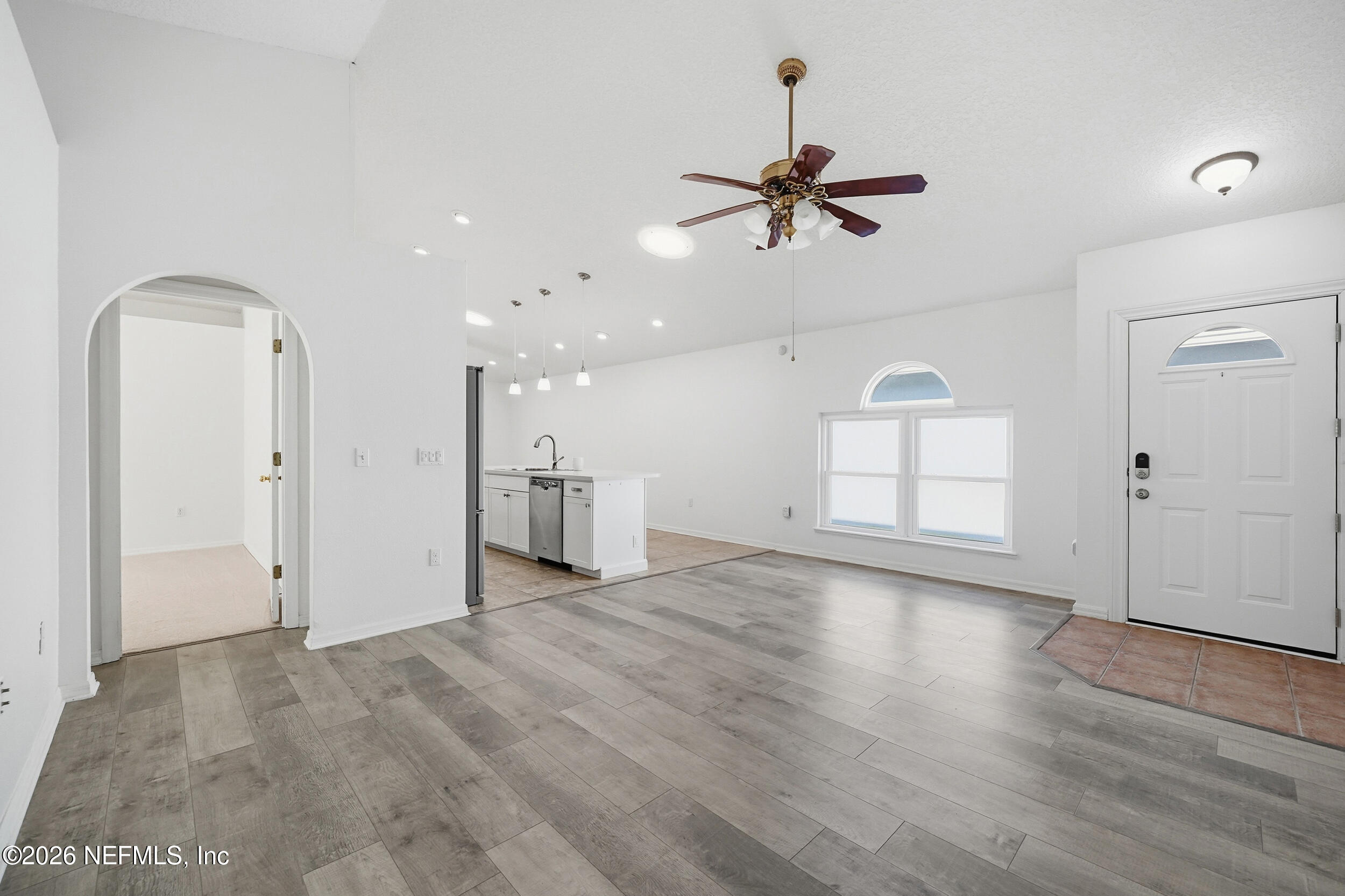3380 Net Court Jacksonville, FL 32277 - Photo 9 of 20 a view of empty room with wooden floor and ceiling fan