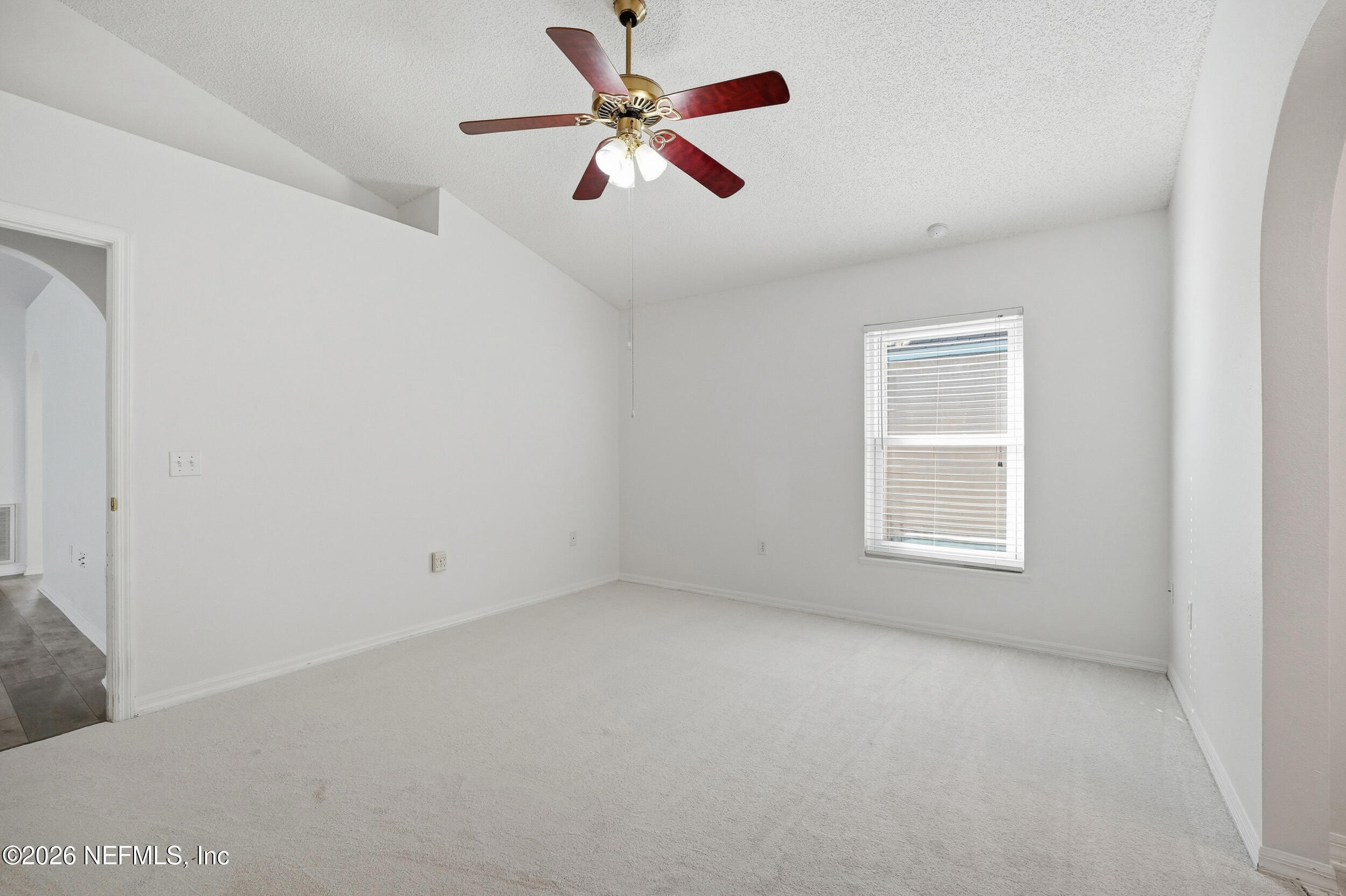3380 Net Court Jacksonville, FL 32277 - Photo 10 of 20 an empty room with a window and a fan