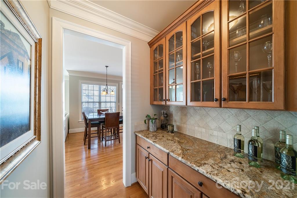 268 Hemmingway Lane Fort Mill, SC 29708 - Photo 11 of 43 a kitchen with granite countertop a sink and a stove top oven