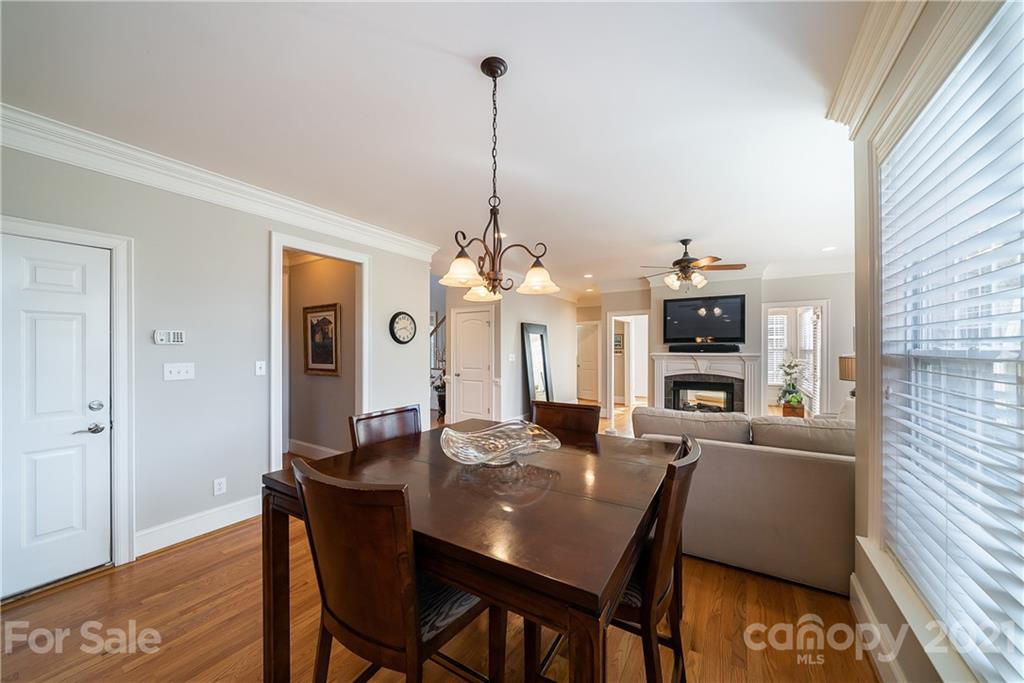 268 Hemmingway Lane Fort Mill, SC 29708 - Photo 17 of 43 a view of a dining room with furniture and wooden floor