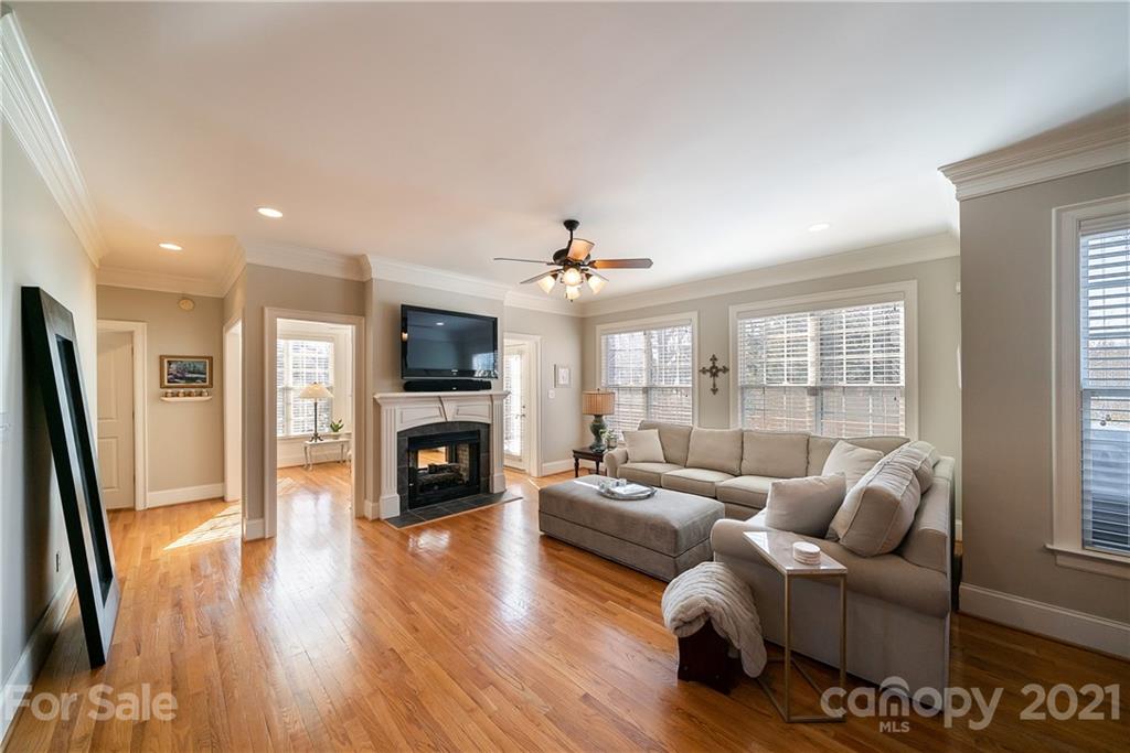 268 Hemmingway Lane Fort Mill, SC 29708 - Photo 18 of 43 a living room with furniture a fireplace and a flat screen tv
