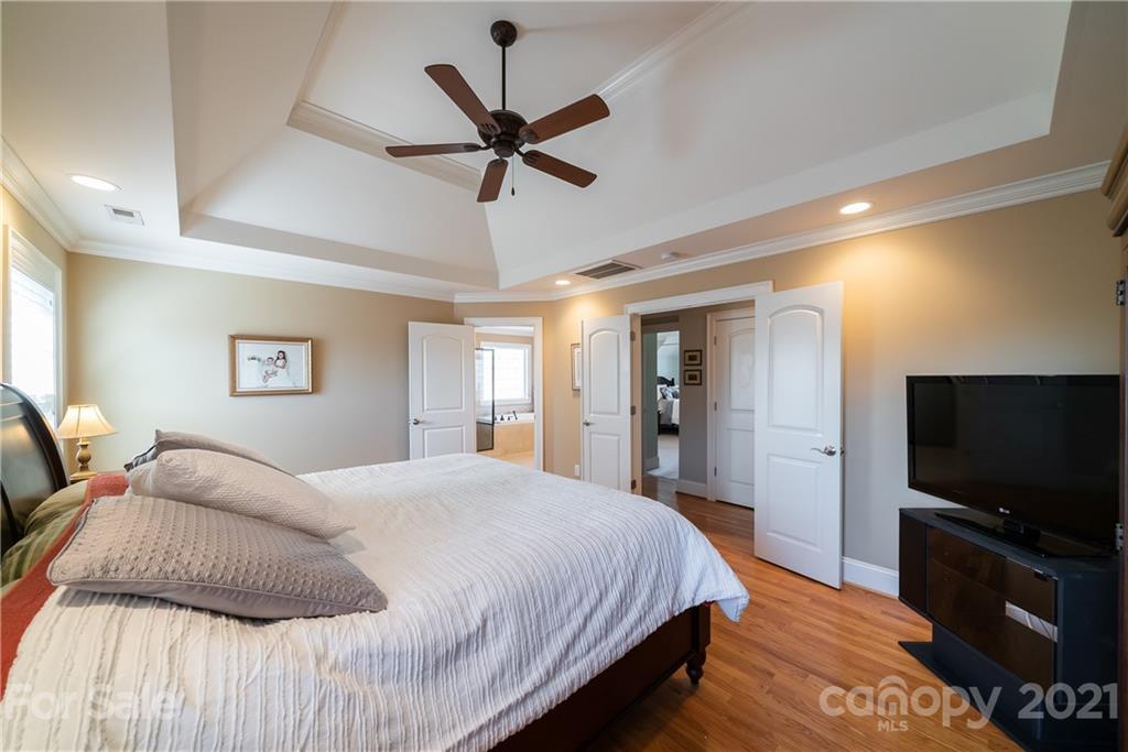 268 Hemmingway Lane Fort Mill, SC 29708 - Photo 25 of 43 a spacious bedroom with a bed and a flat screen tv